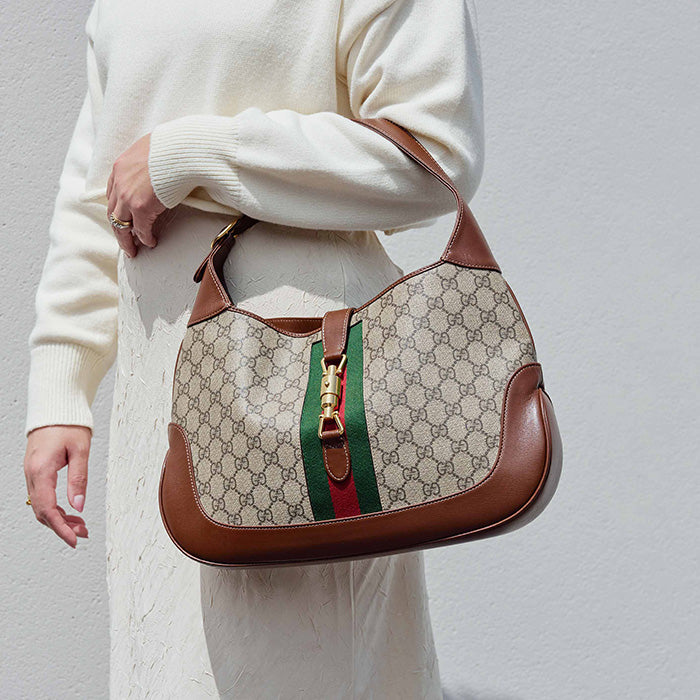 lifestyle image of model wearing the gucci medium jackie 1961 hobo bag FASHIONPHILE