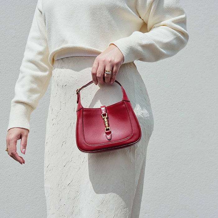 lifestyle image of model wearing the gucci mini jackie 1961 hobo bag FASHIONPHILE
