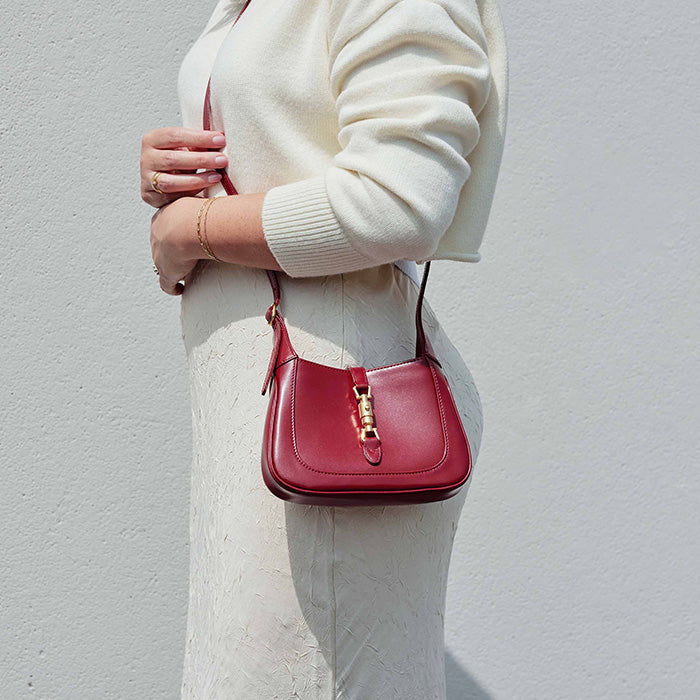 lifestyle image of model wearing the gucci mini jackie 1961 hobo bag FASHIONPHILE