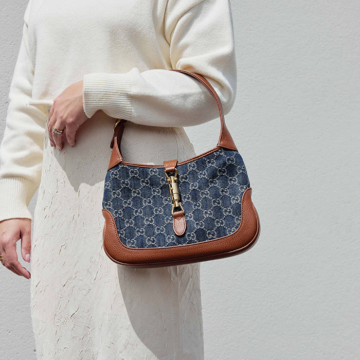 lifestyle image of model wearing the gucci small jackie 1961 hobo bag FASHIONPHILE