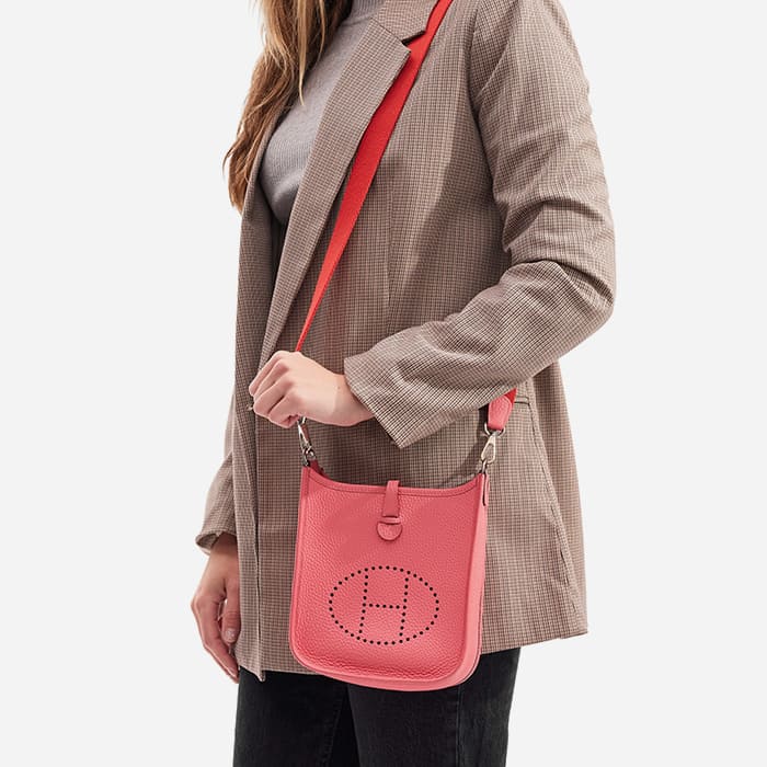 the hermes evelyne tpm size worn as a shoulder bag by FASHIONPHILE