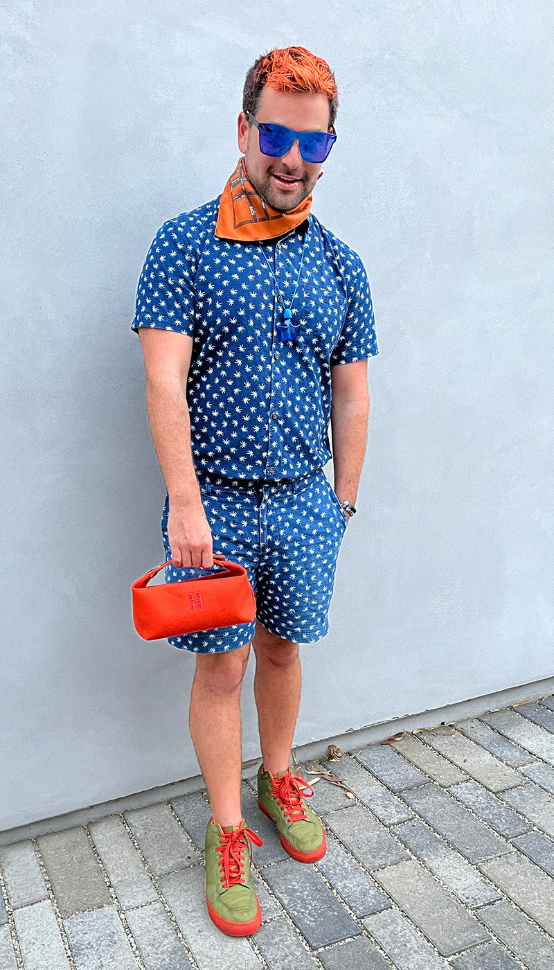 lifestyle image of influencer wearing hermes orange scarf and hermes bag FASHIONPHILE