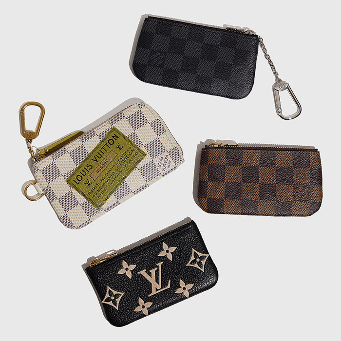 studio image of Louis Vuitton key pouches grouped together Organization Is Key: Exploring Louis Vuitton Key Pouches