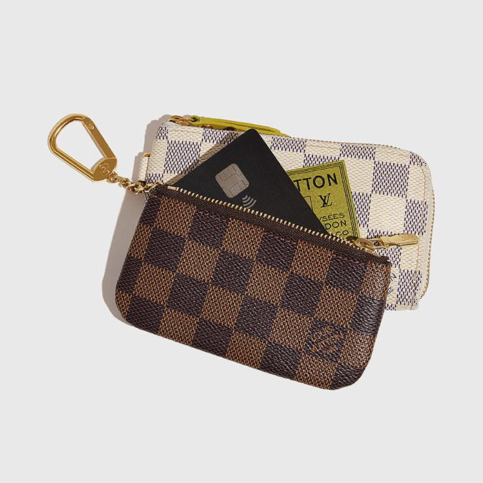 studio image of card inside louis vuitton key pouches FASHIONPHILE