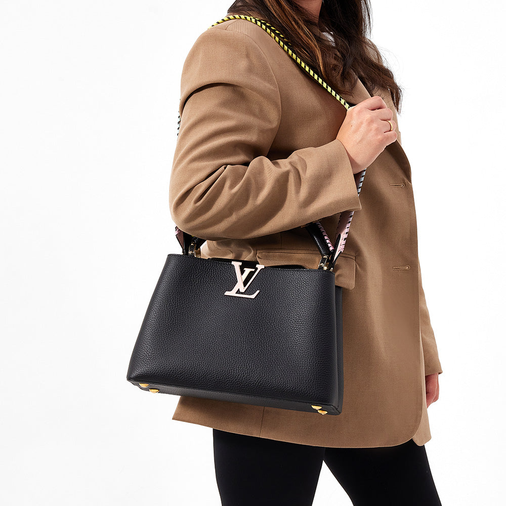 black leather louis vuitton capucines mm worn as a shoulder bag by FASHIONPHILE