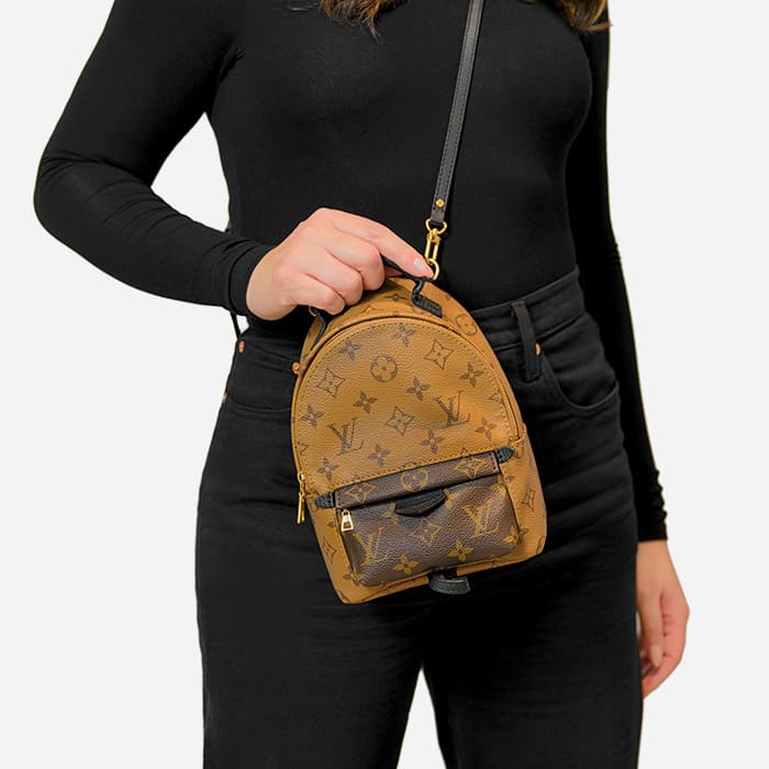 ways to wear the louis vuitton mini palm springs backpack with model wearing it as a crossbody by FASHIONPHILE
