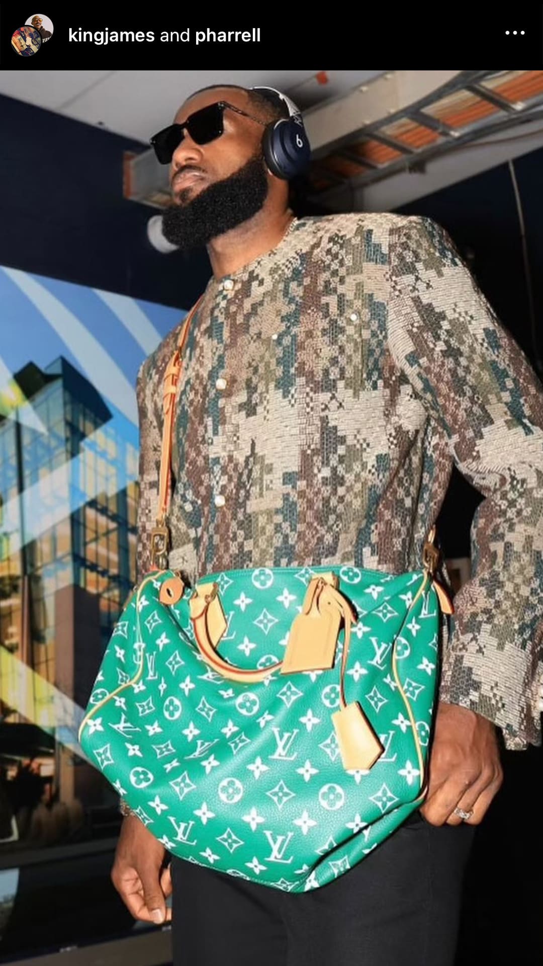 screenshot image of LeBron James wearing a louis vuitton green leather monogram Speedy bag by FASHIONPHILE