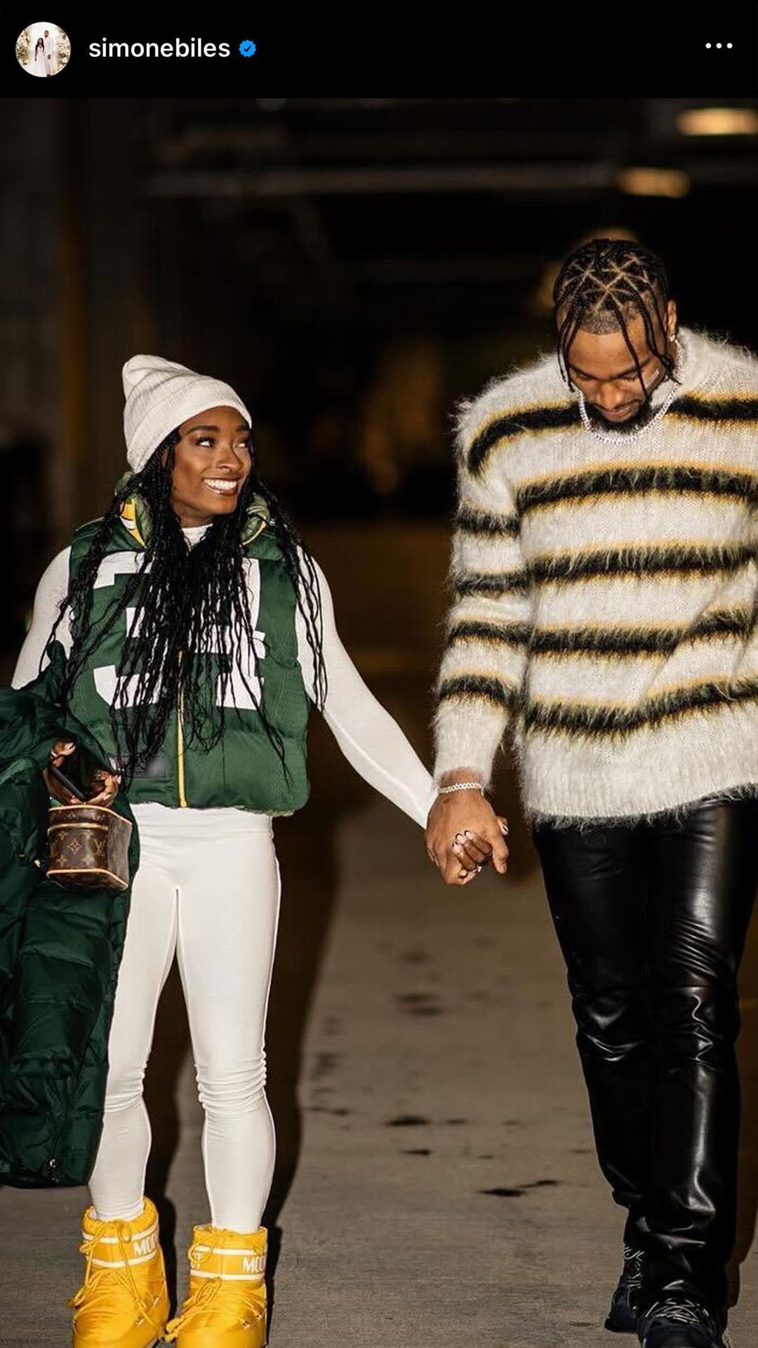 screenshot image of Simone Biles walking with her husband wearing a louis vuitton monogram vanity case