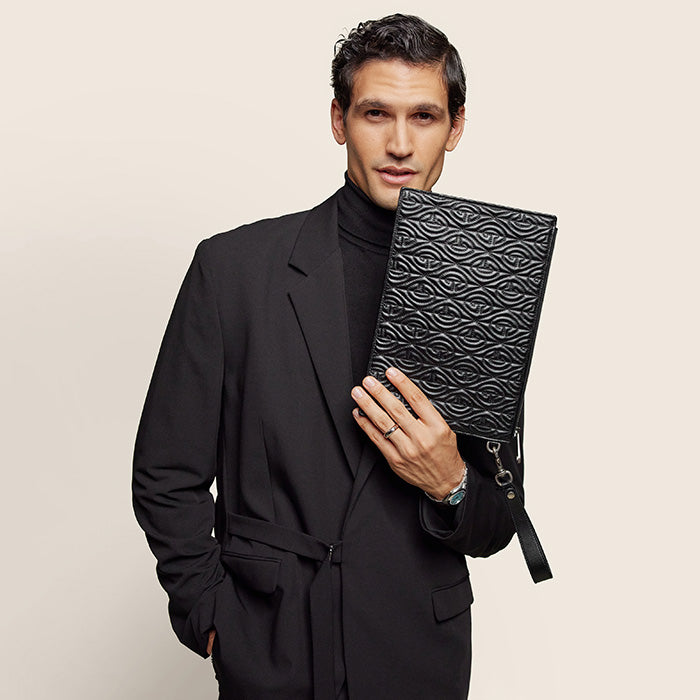 image of male model with designer bag FASHIONPHILE