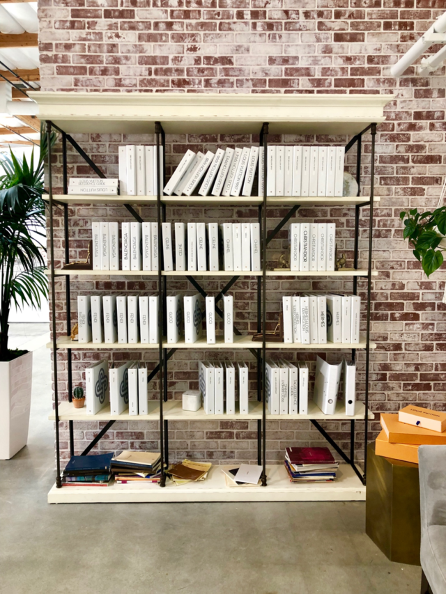 behind the scenes image of The FASHIONPHILE brand guides wall at our Headquarters in Carlsbad, California