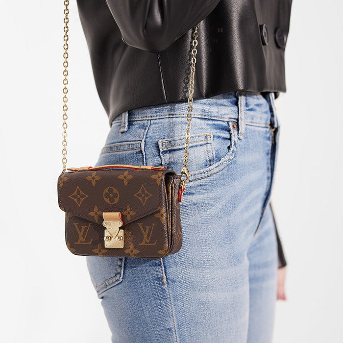 lifestyle image of louis vuitton micro metis with chain strap FASHIONPHILE