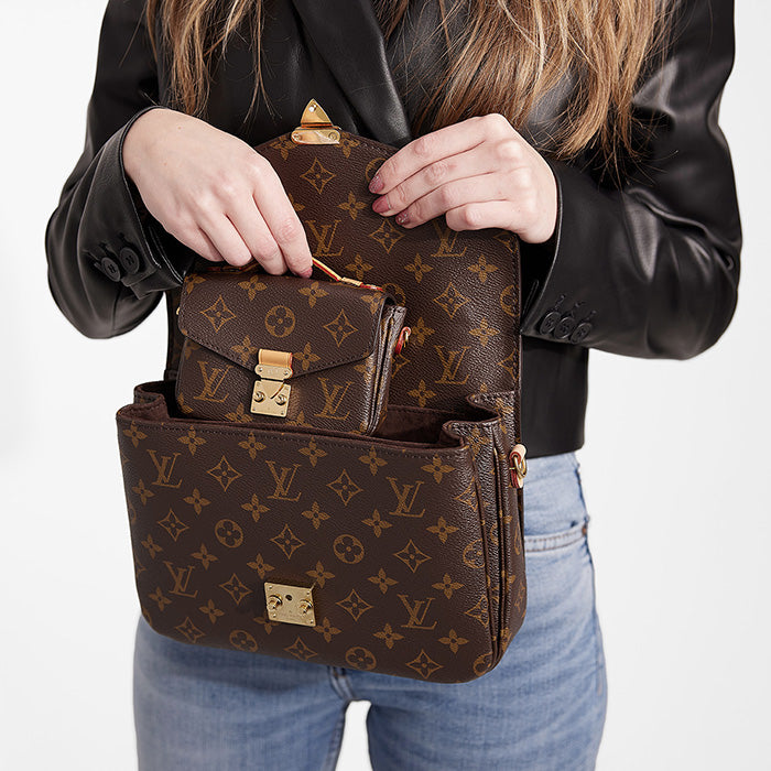 lifestyle image of what fits inside the louis vuitton pochette metis FASHIONPHILE