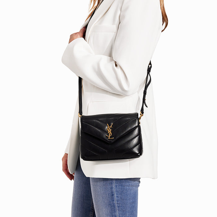 studio image of model wearing saint laurent toy loulou bag FASHIONPHILE
