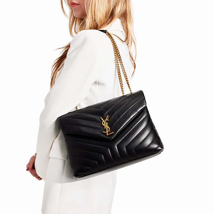 studio image of model wearing saint laurent medium loulou bag FASHIONPHILE