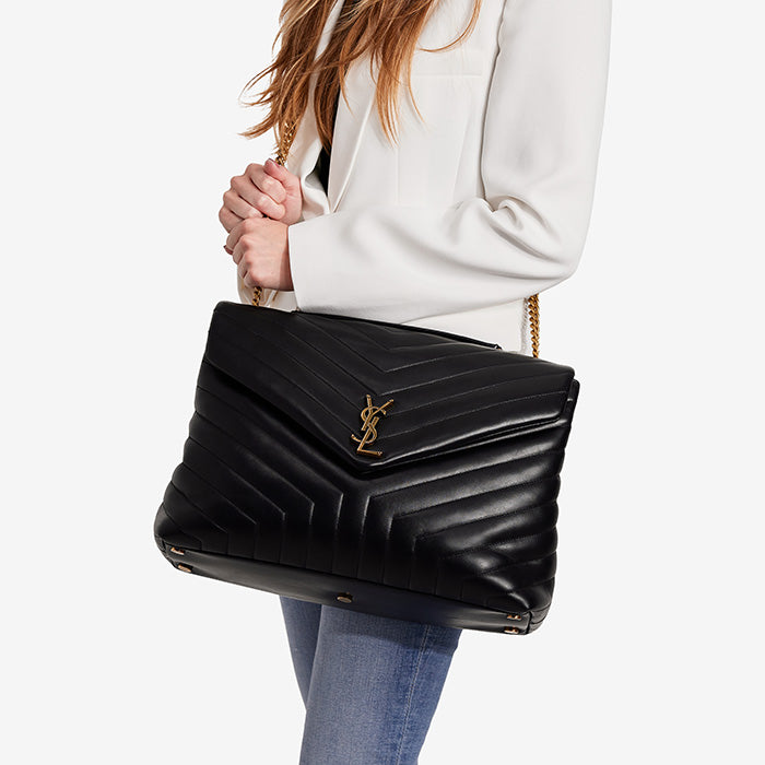 studio image of model wearing saint laurent large loulou bag FASHIONPHILE