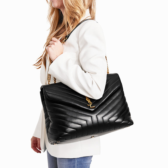 studio image of model wearing saint laurent large loulou bag FASHIONPHILE