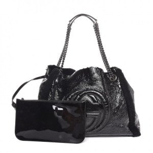 With popping distressed patent leather and shearling trim this Gucci bag is the epitome of laid-back luxury.
