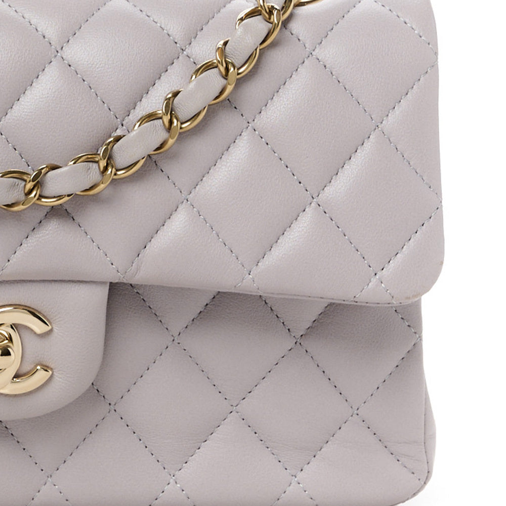 Close up of stitching on a light grey Chanel Double Flap