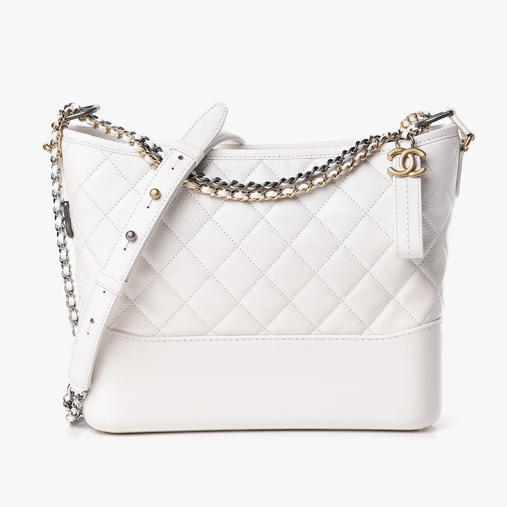 this is a front view image of an authentic white chanel gabrielle hobo bag by fashionphile