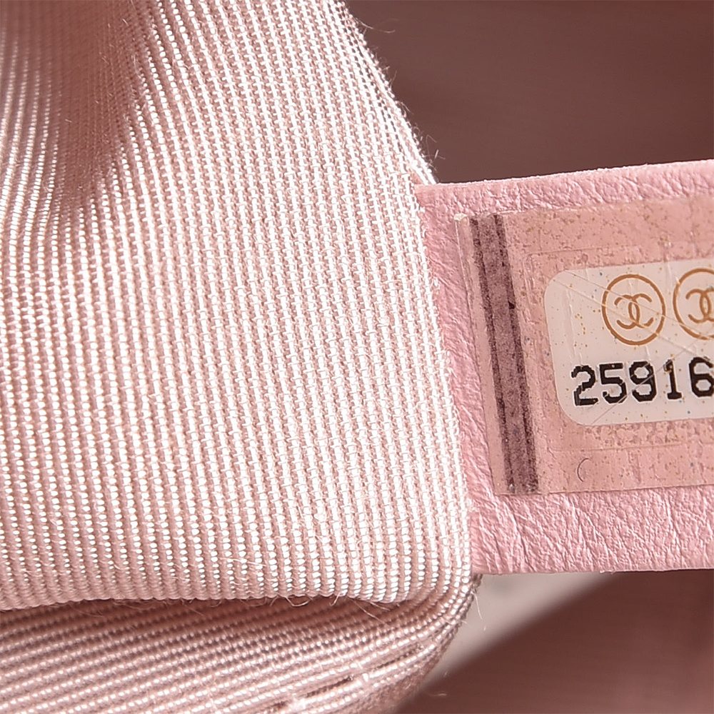 this is a close up image of an authentic chanel serial sticker by fashionphile