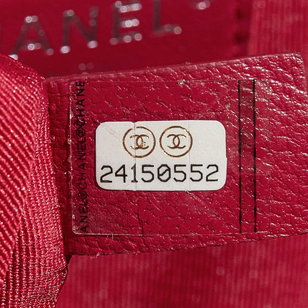 this is a close up view image of a fake chanel serial code sticker by fashionphile