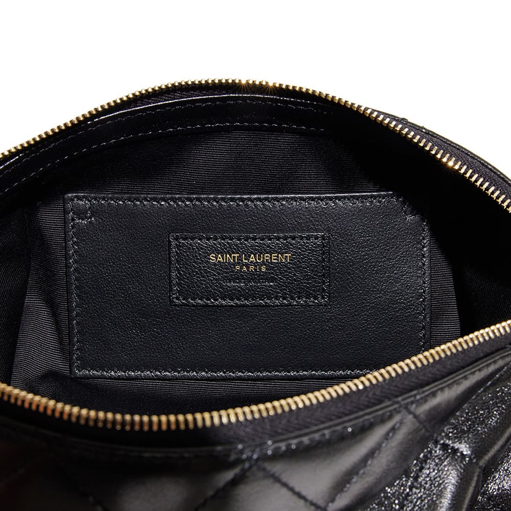 the interior of an authentic saint laurent icare maxi shopping tote showing the brand tag by FASHIONPHILE