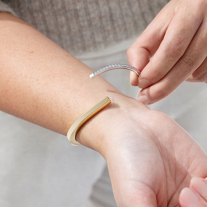 lifestyle image of model putting on Tiffany Lock bracelet FASHIONPHILE