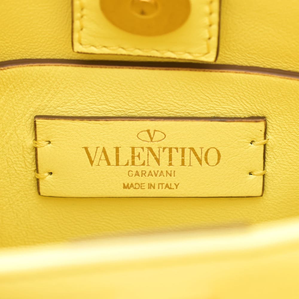 close up of authentic valentino garavani interior brand foil stamp by FASHIONPHILE