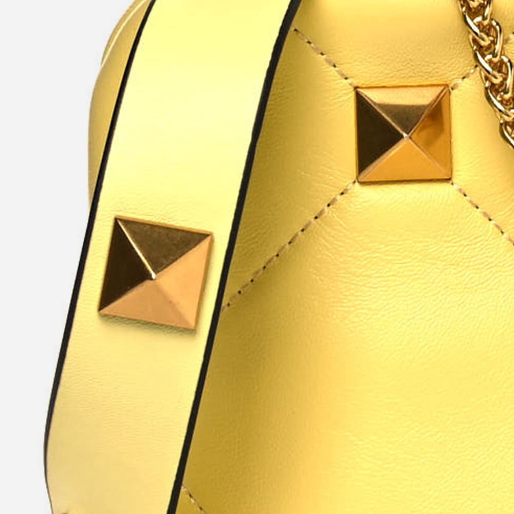 image of fake valentino garavani roman stud hardware by FASHIONPHILE