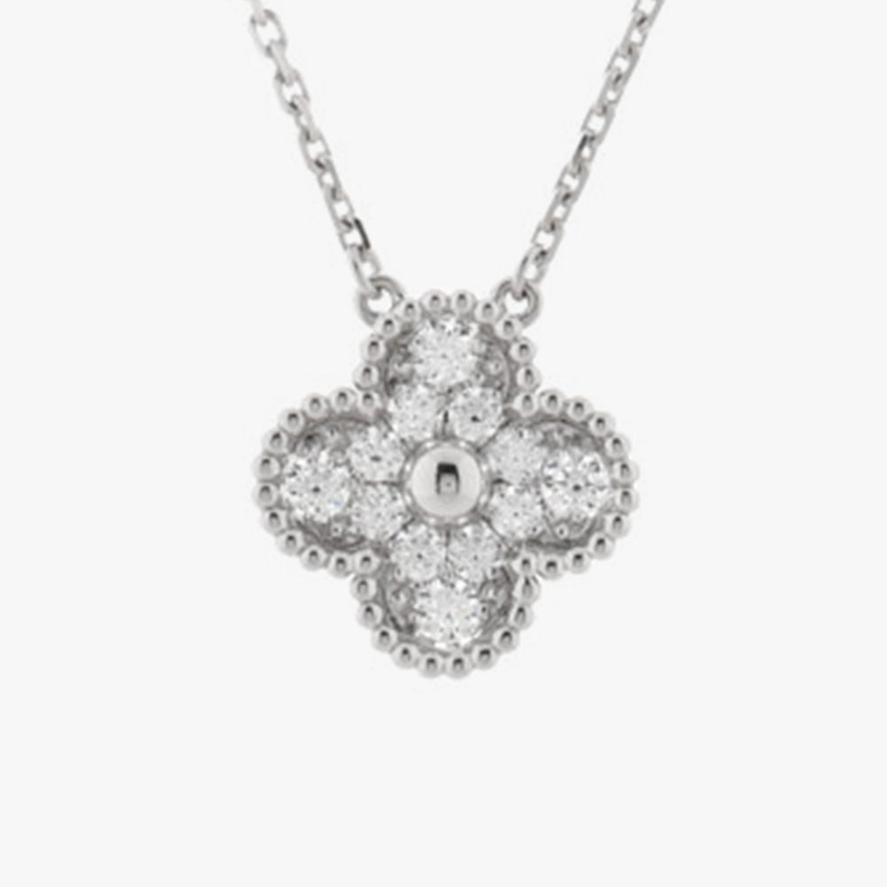 close up image of platinum diamond van cleef & arpels alhambra pendant necklace by fashionphile