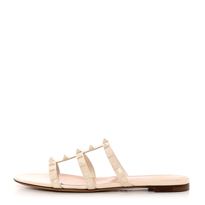 Valentino Garavani Calfskin Lacquered Monochrome Rockstud Caged Flat Slide Sandals 37.5 Ivory 1 of 14
