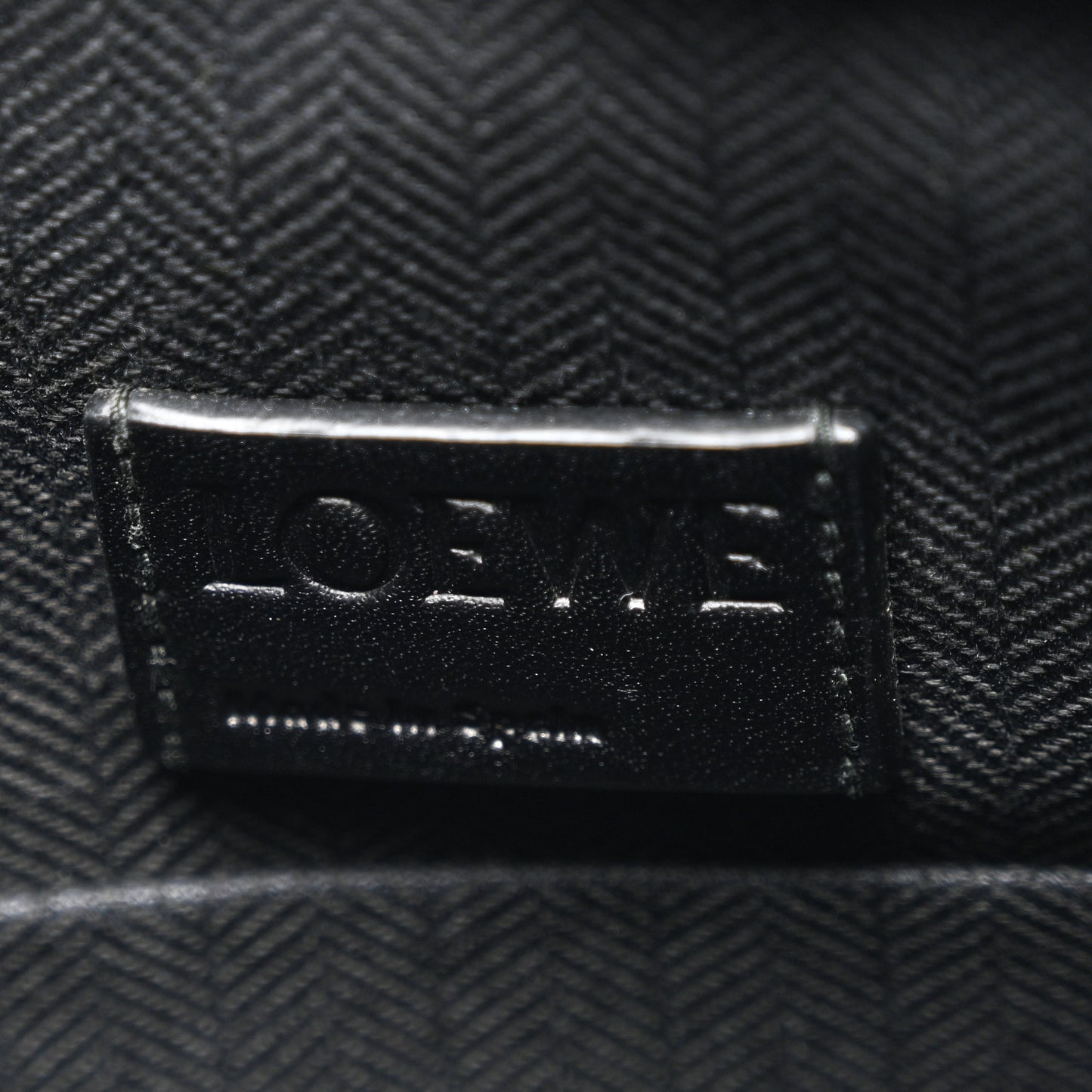 Calfskin Embossed Repeat T Pouch Black