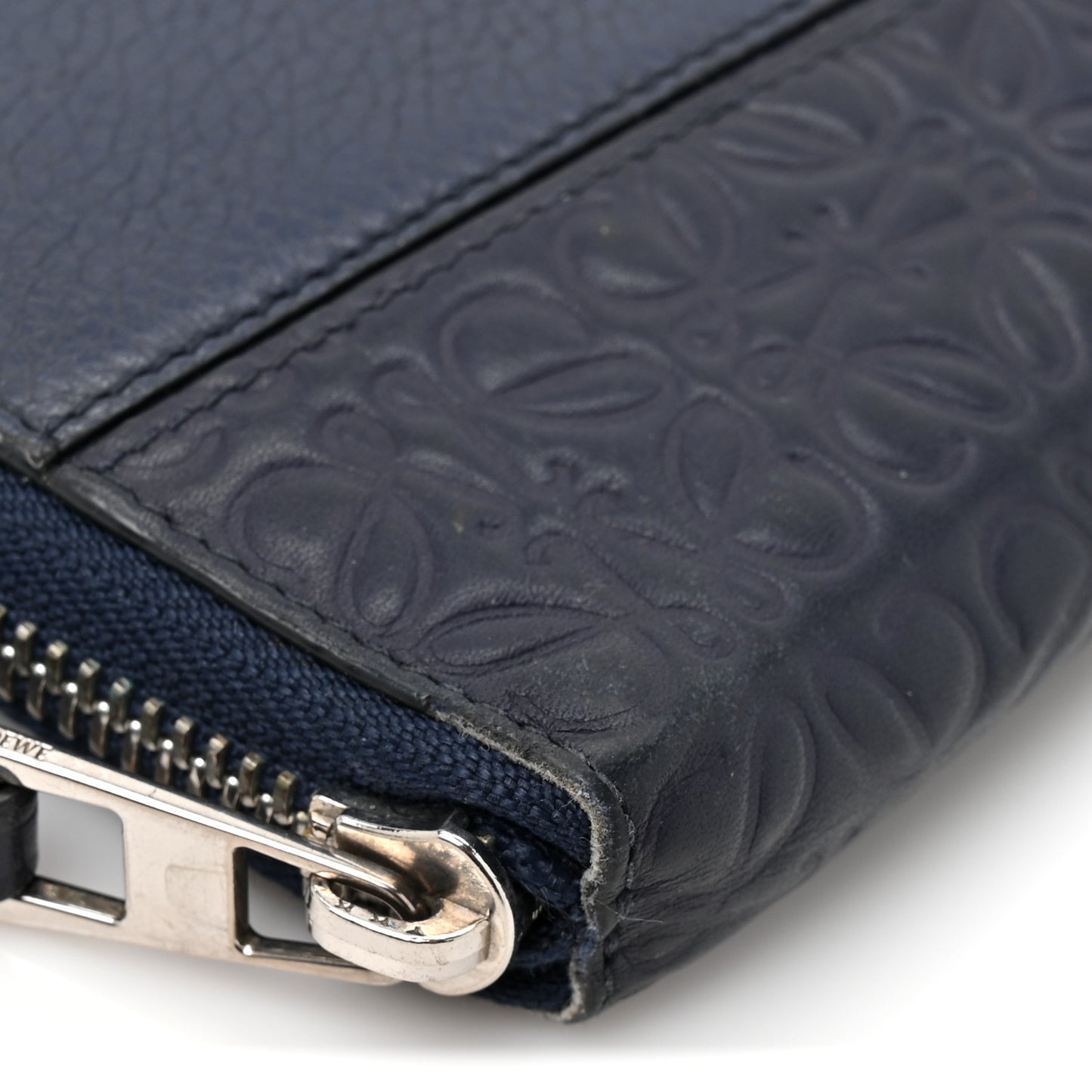 Calfskin Embossed Repeat Puzzle Zip Around Wallet Blue