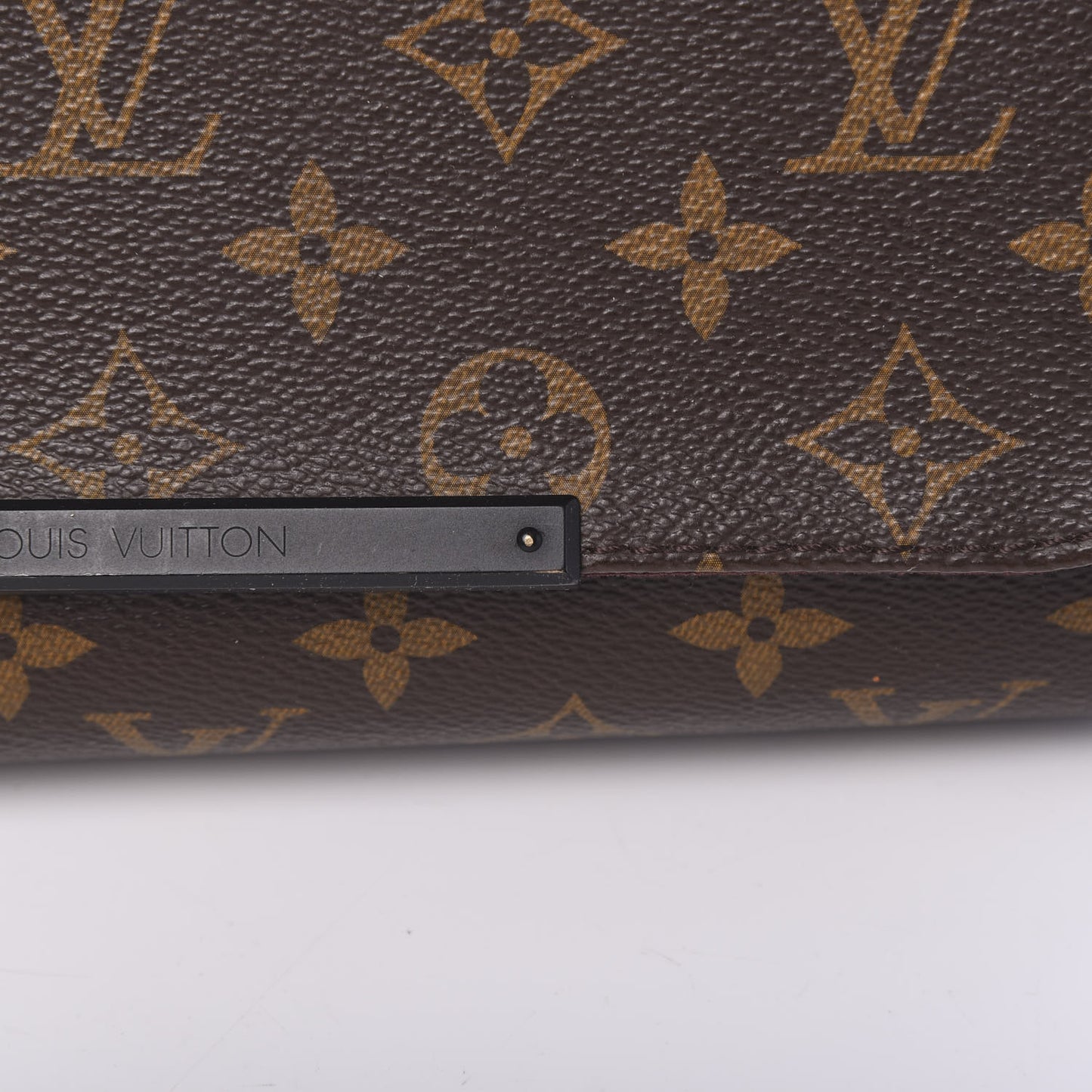 Monogram Macassar District PM