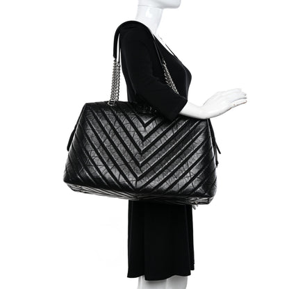 Chanel Aged Calfskin Chevron Quilted Duffle Bag Black 2 of 10