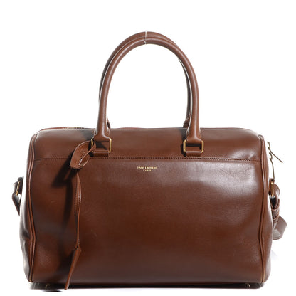 Saint Laurent Calfskin Classic Duffle 6 Cognac 1 of 9