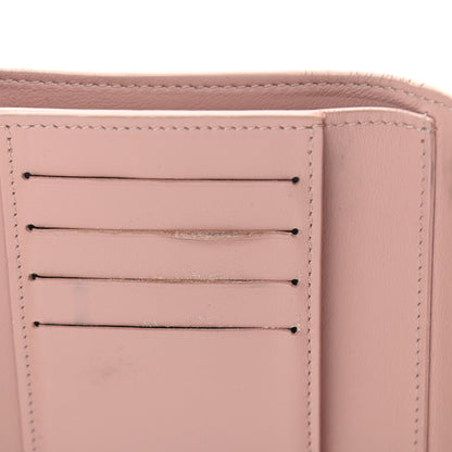 Louis Vuitton Taurillon Perforated Capucines Compact Wallet Magnolia 7 of 9