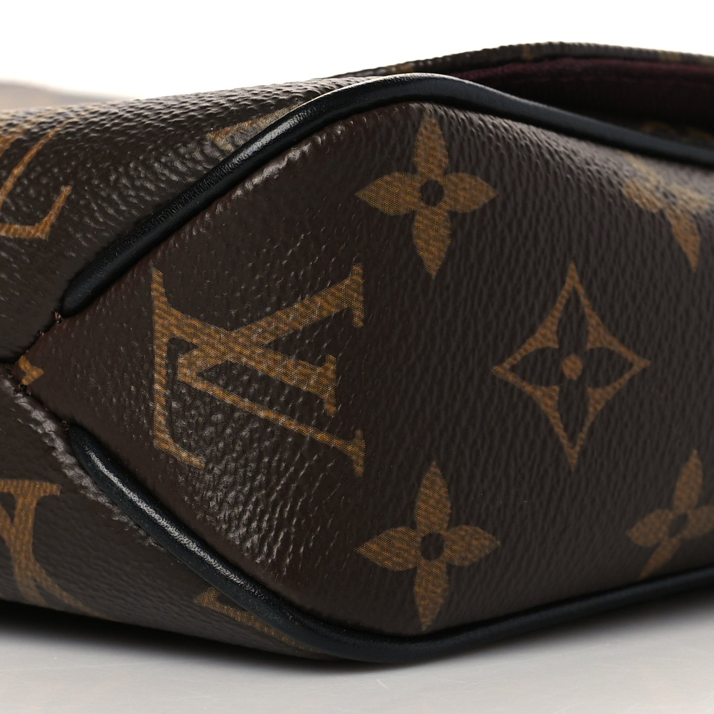 Monogram Macassar District PM