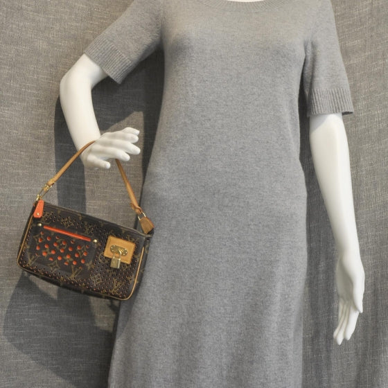 Monogram Perforated Pochette Accessories Bag Orange