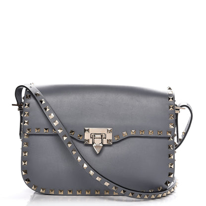 Valentino Garavani Vitello Medium Rockstud Flap Saddle Bag Light Stone 1 of 8