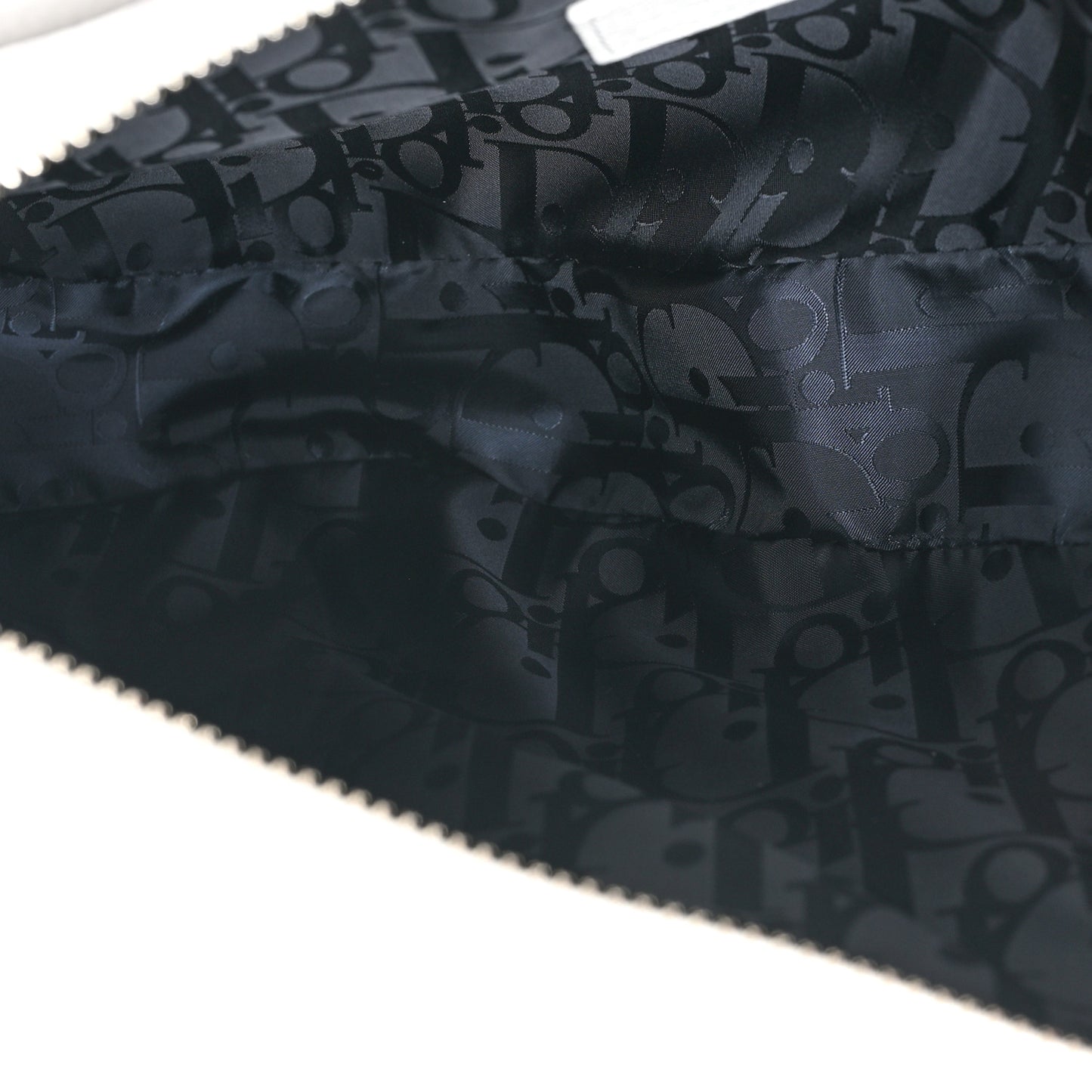 X Daniel Arsham Grained Calfskin Newspaper Print Saddle Bag White