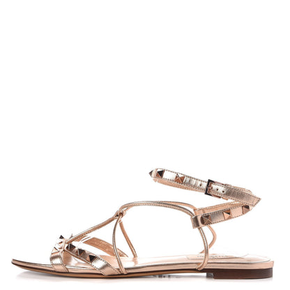 Valentino Garavani Metallic Nappa Rockstud Criss Cross Ankle Wrap Flat Sandals 39 Rame 1 of 7