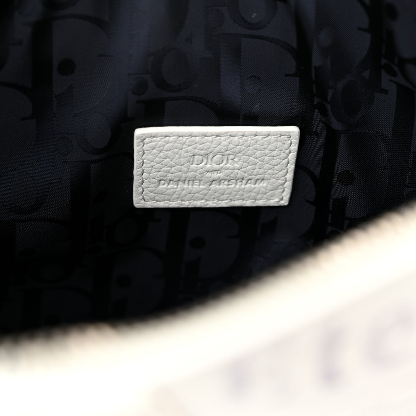 X DANIEL ARSHAM Grained Calfskin Newspaper Print Saddle Bag White