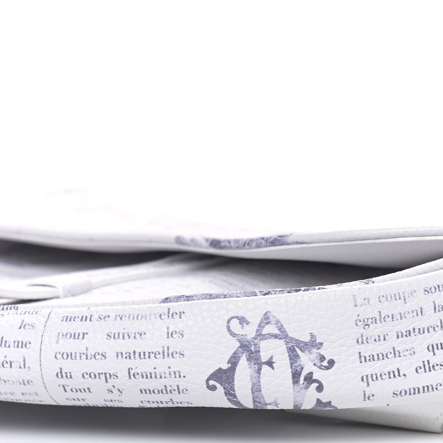 X DANIEL ARSHAM Grained Calfskin Newspaper Print Saddle Bag White