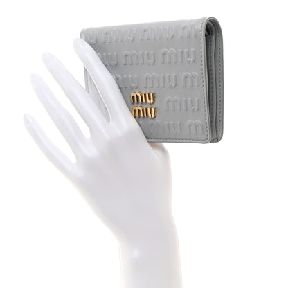 Miu Miu MIU MIU Calfskin Logo Embossed Bi-Fold Compact Wallet Fiordaliso 2 of 8