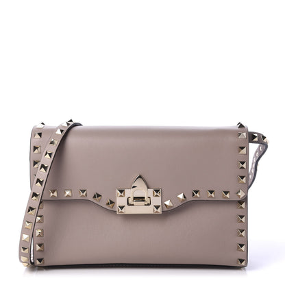 Valentino Garavani Vitello Medium Rockstud Flip Lock Crossbody Bag Poudre 1 of 9