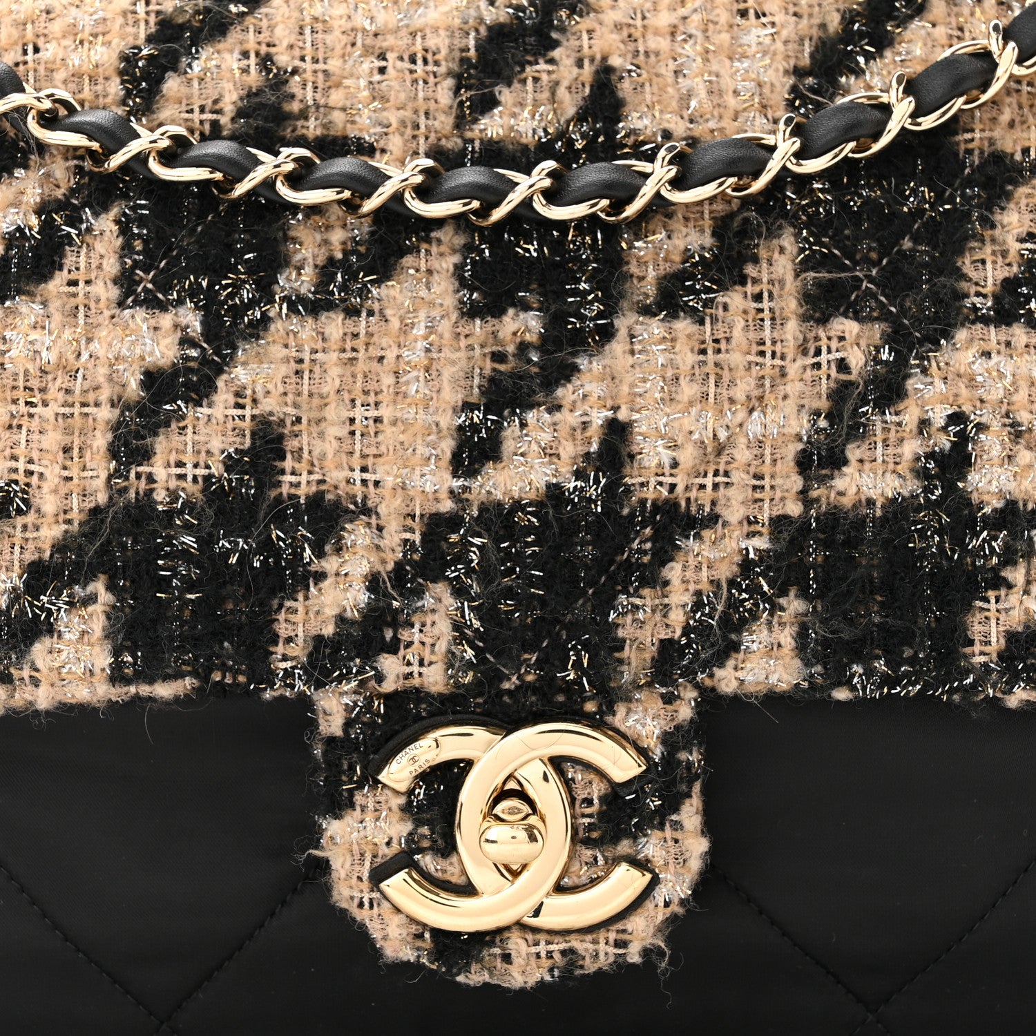 close up image of chanel tweed in beige and black by FASHIONPHILE