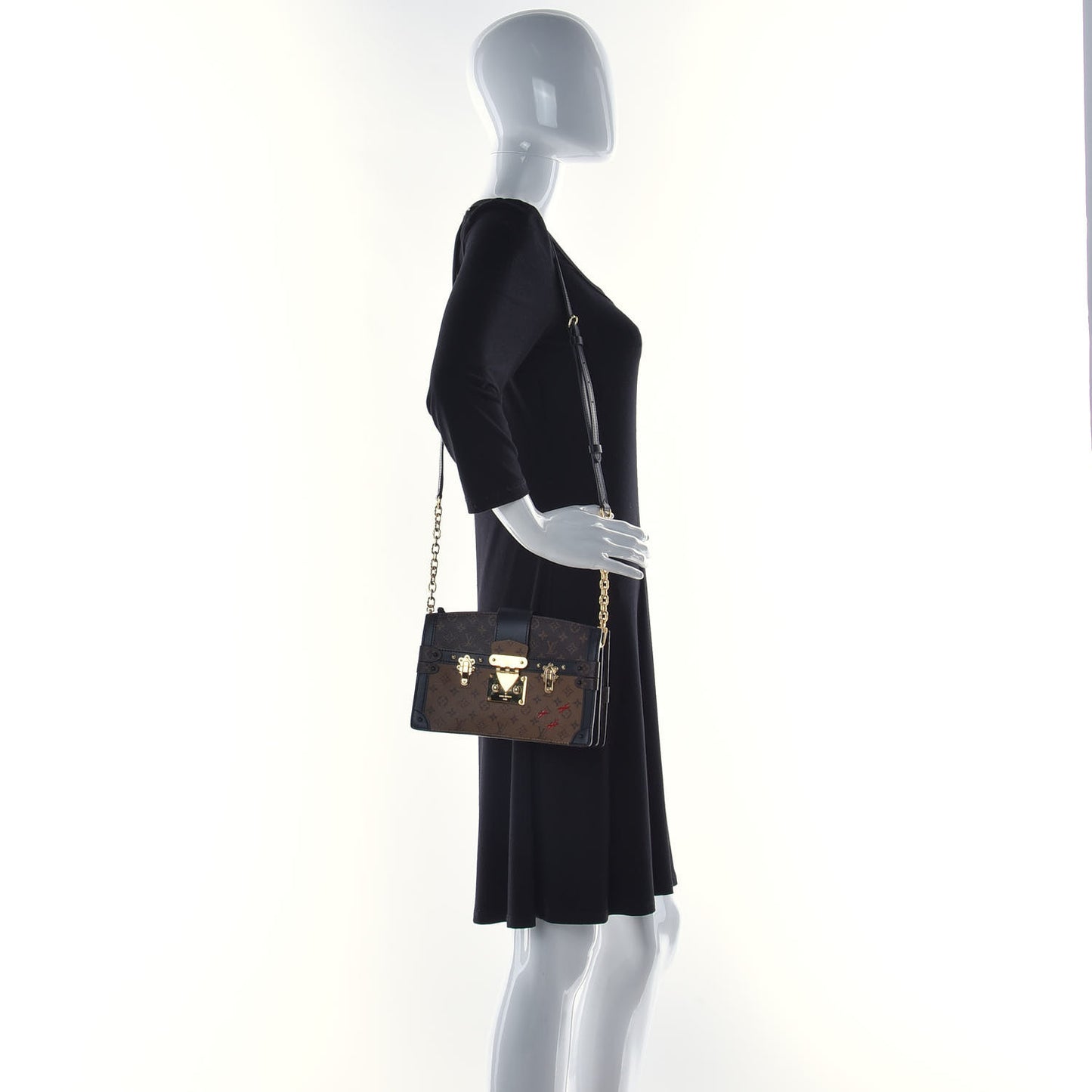 Reverse Monogram Trunk Clutch
