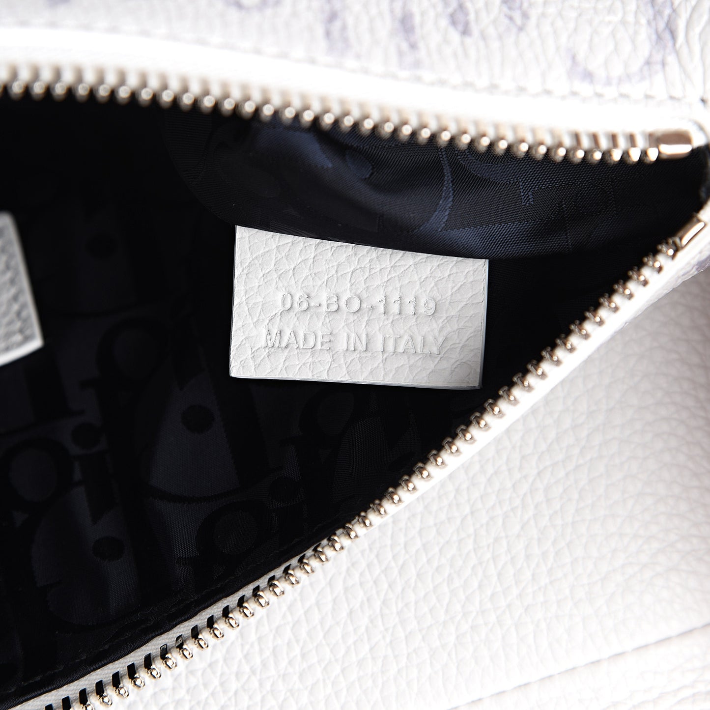 X DANIEL ARSHAM Grained Calfskin Newspaper Print Saddle Bag White