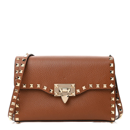 Valentino Garavani Pebbled Calfskin Medium Rockstud Flip Lock Crossbody Bag Bright Cognac 1 of 8